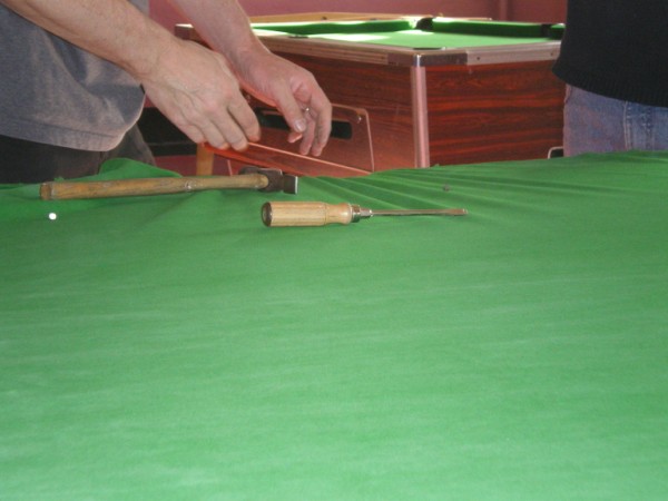 FITTER INSTALLING BEDCLOTH